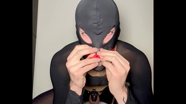 Image Sissy cross dresser strips in chastity while showing you his feet and slapping his balls