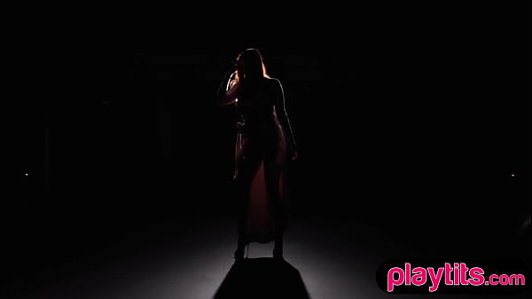 Image Busty mature redhead MILF strips on stage to flaunt her huge tits