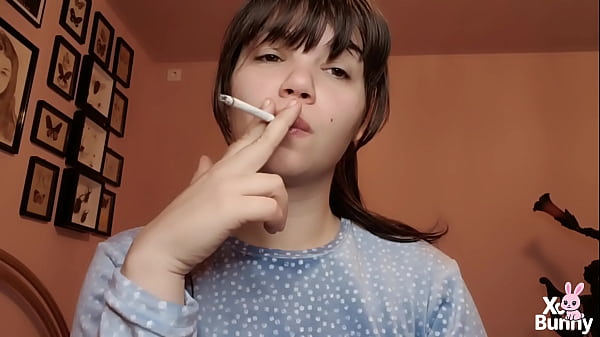 Image Big lips covered in lipgloss smoking with close up of the lips