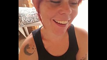 Image Redhead talks to her husband while sucking her lover's cock