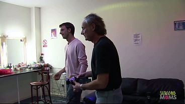 Image Wearing stockings helps the brunette milfs with fake boobs get in the mood for group sex