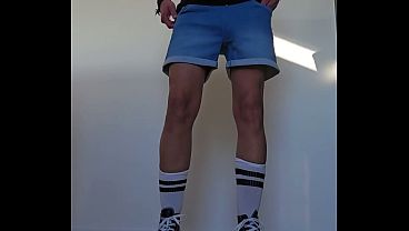 Image Masturbator in short jeans, white socks and converse sneakers