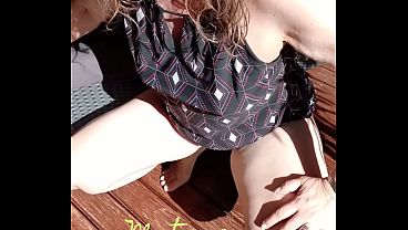 Image Maturemons, horny mature with top on and pants off squats outdoors to display gaping vagina