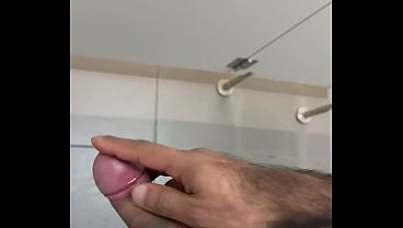 Image JERKING OFF IN A PUBLIC RESTROOM