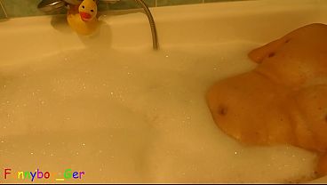 Image Masturbating in the bathtub with foam, a vibrator on penis makes him produce precum. (S)