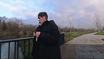 Image A mature woman walk in public with her big saggy tits exposed