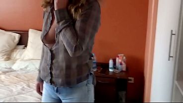 Image Stepmom completely naked shows off and puts on jeans without panties