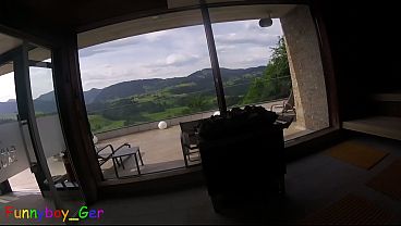 Image Sweating in a public panoramic sauna in the mountains, I play with my soft penis.